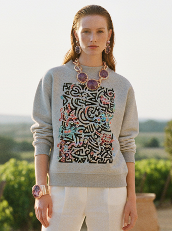 Gray sweatshirt with a colorful geometric pattern on a white background
